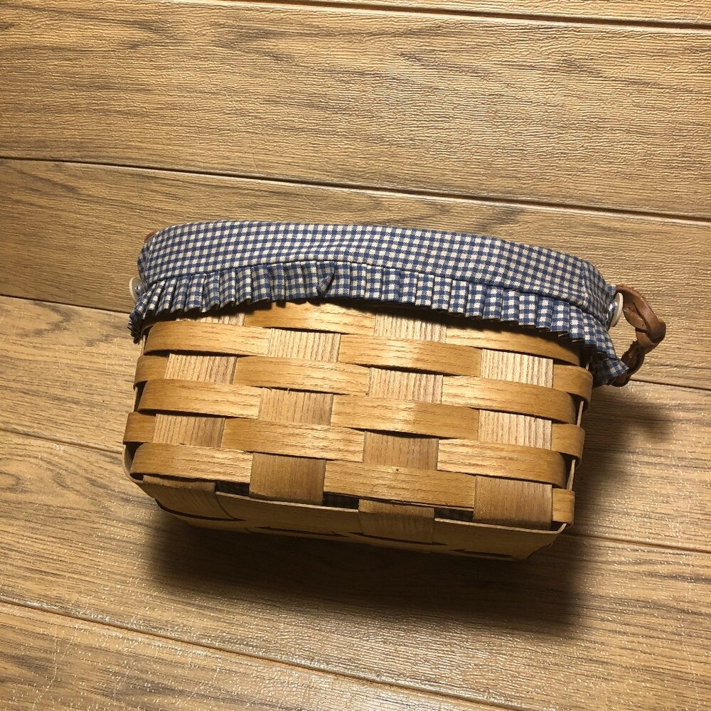 Vintage Peterboro medium size woven basket with original blue yellow gangham cot
